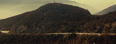 a mountain with a road going through it