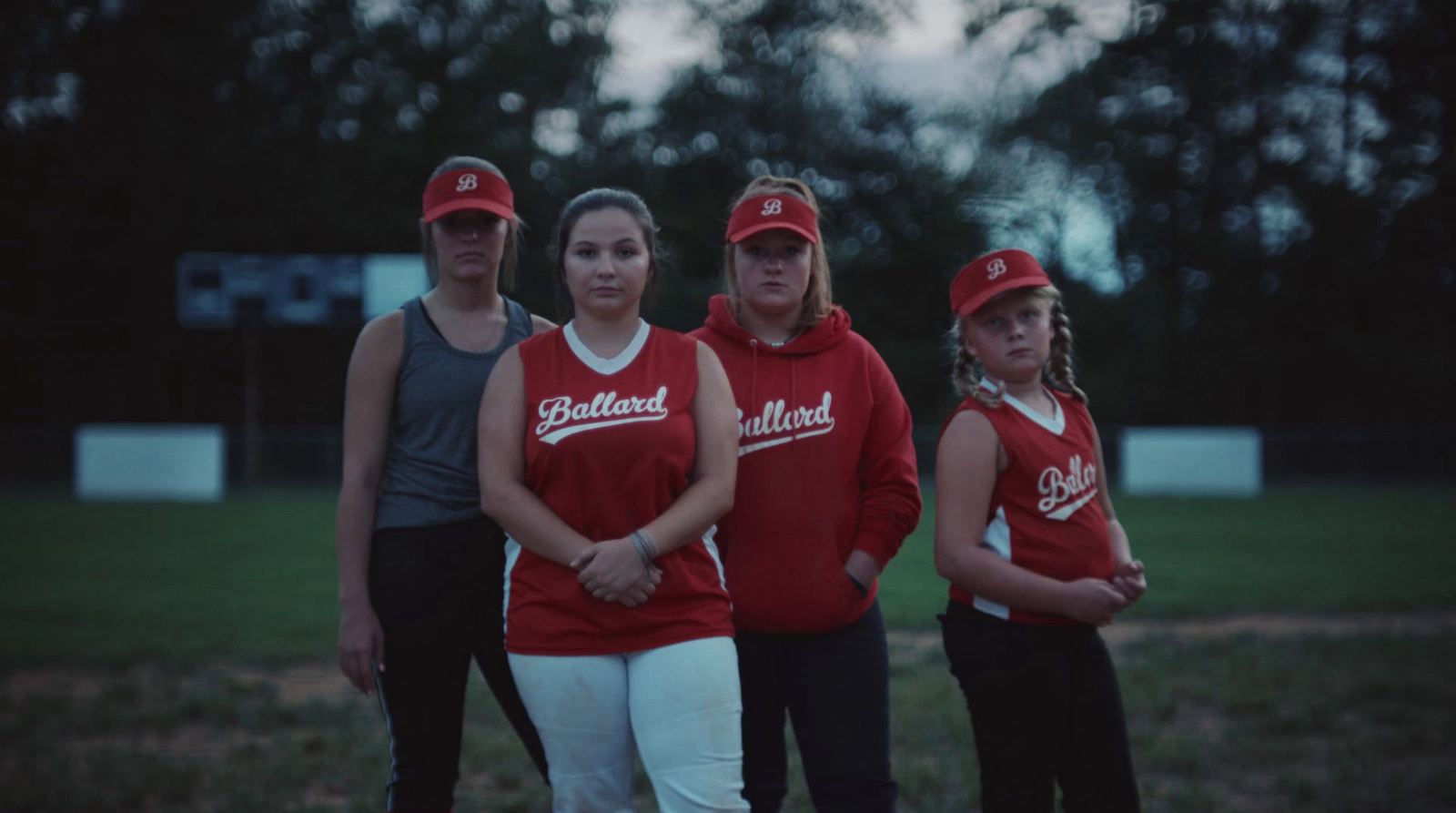 a group of young women standing next to each other