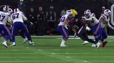 a group of football players playing a game of football