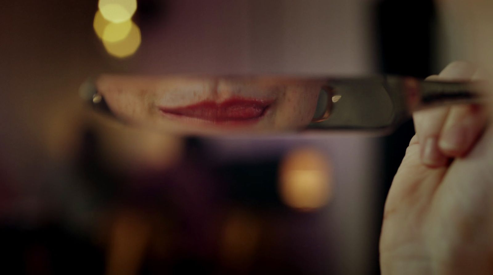 a woman looking through a magnifying glass