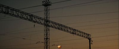 a large tower with lots of wires above it