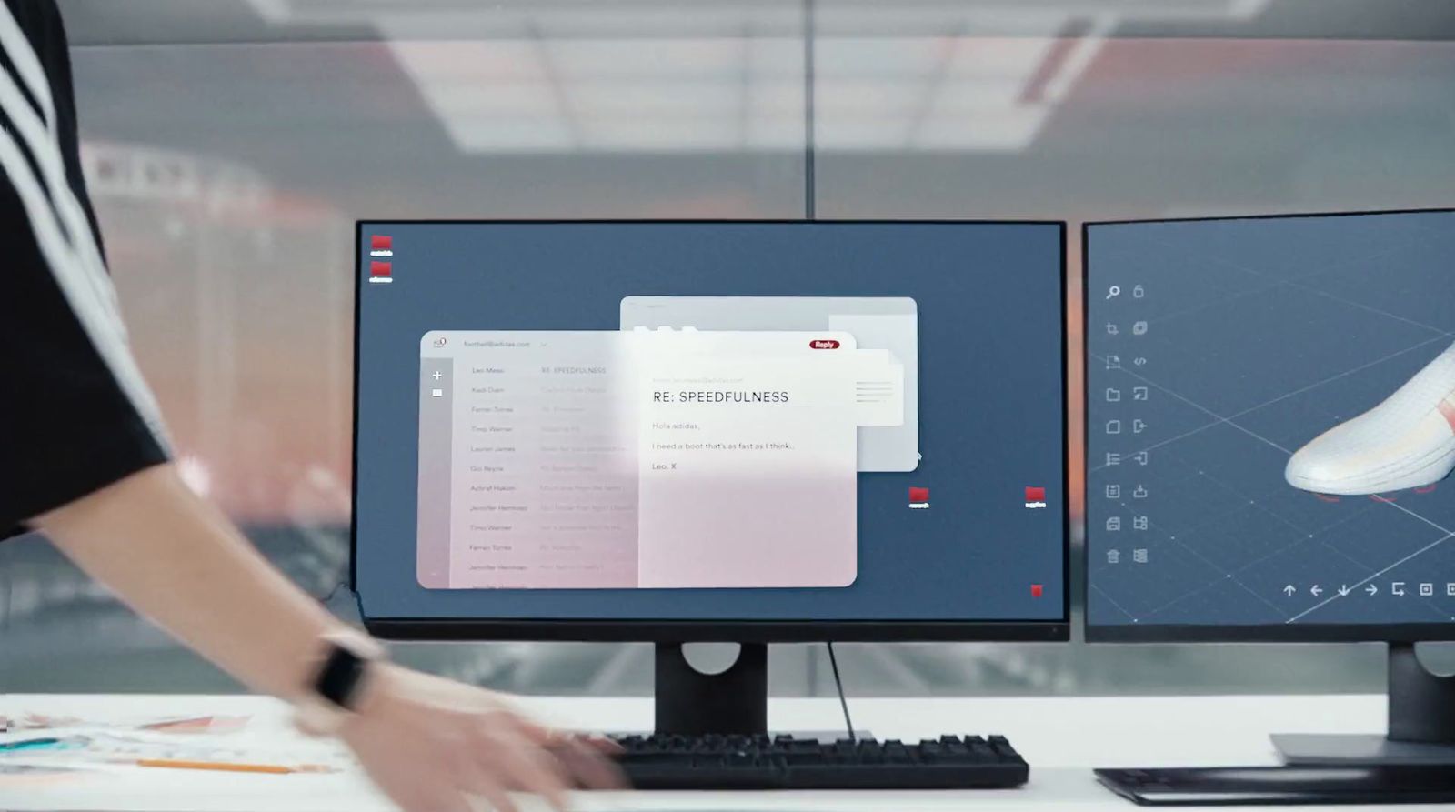 a person standing in front of two computer monitors