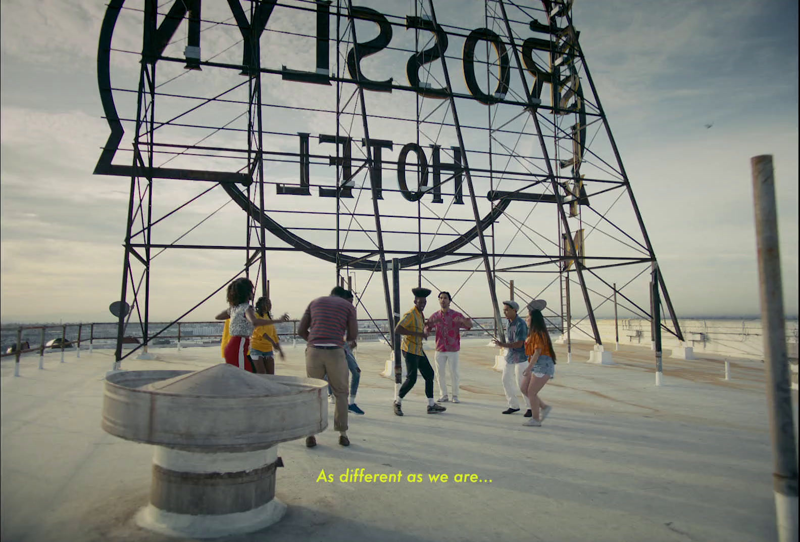 a group of people standing in front of a sign that says boston hotel