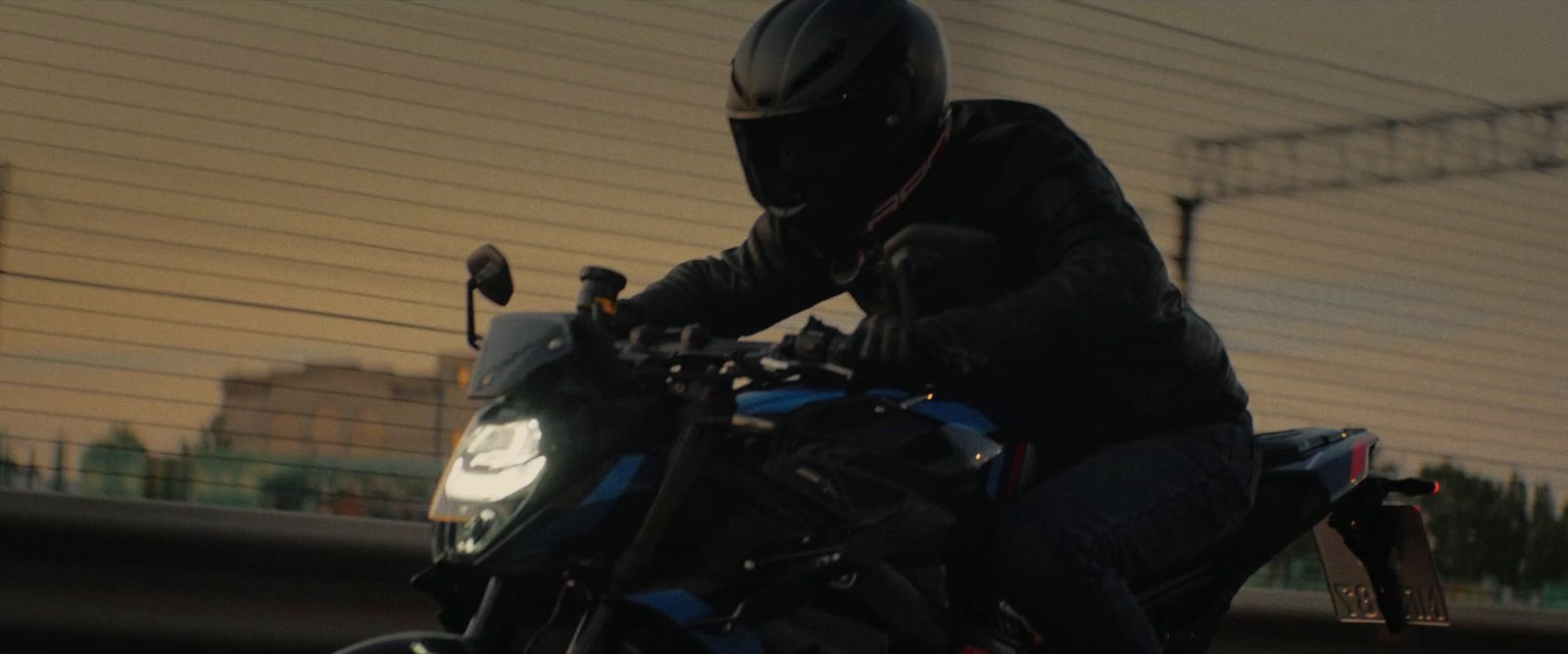 a person riding a motorcycle on a city street