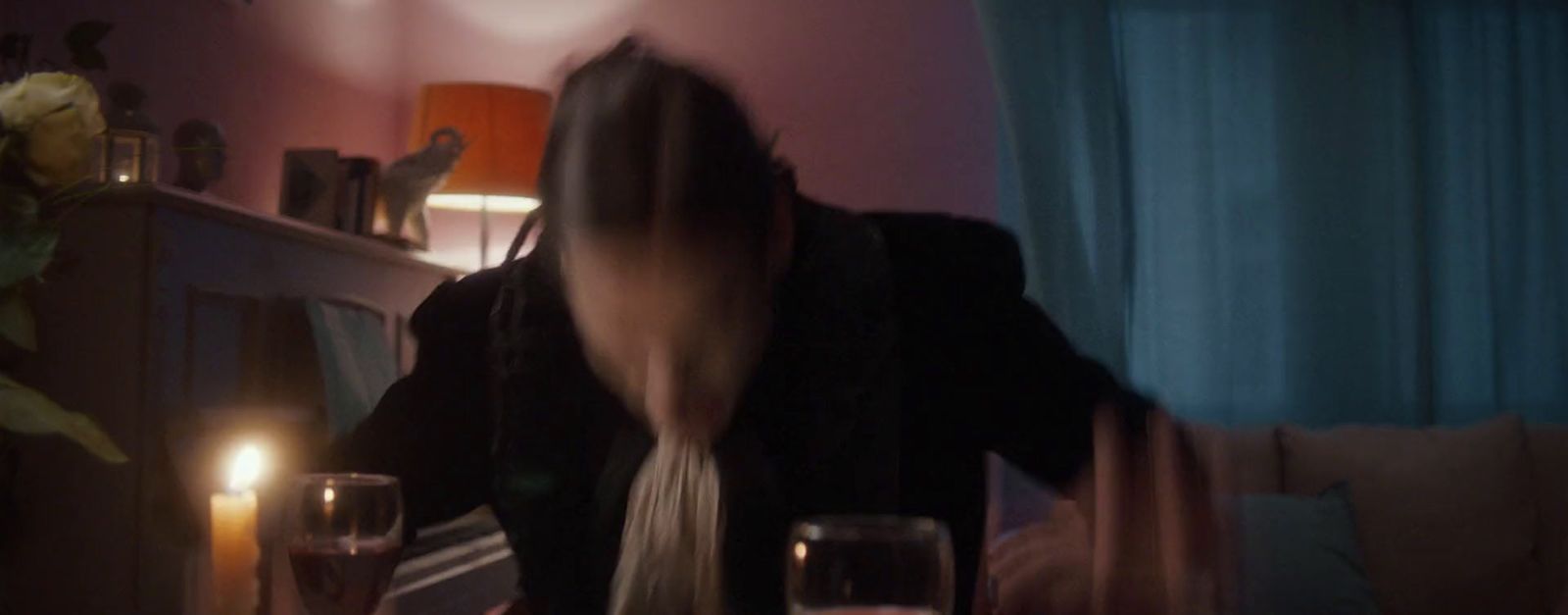 a blurry photo of a person sitting at a table