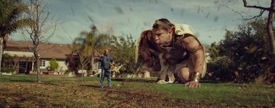 a man and a woman standing in a yard