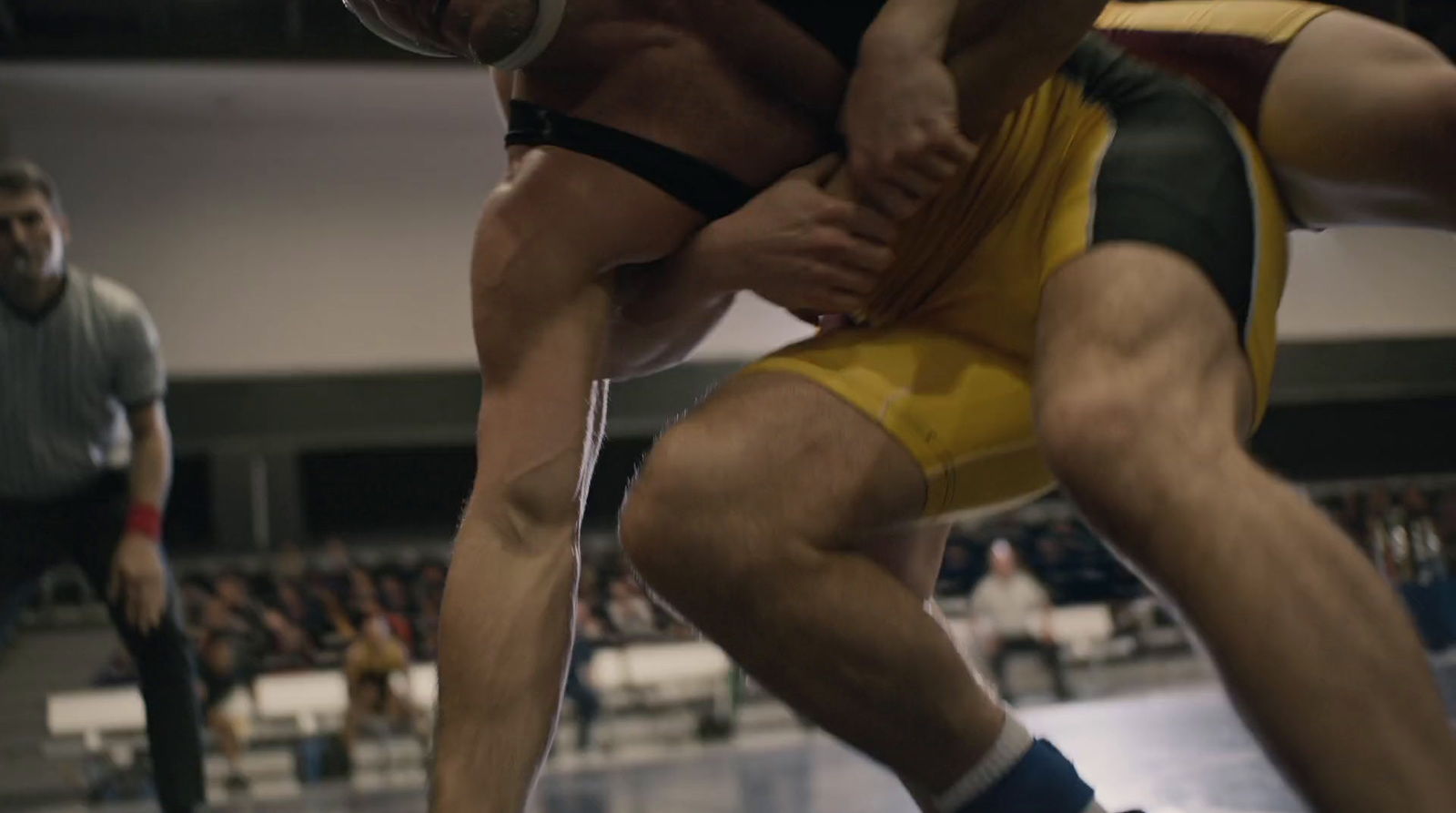 a couple of men standing on top of a wrestling ring