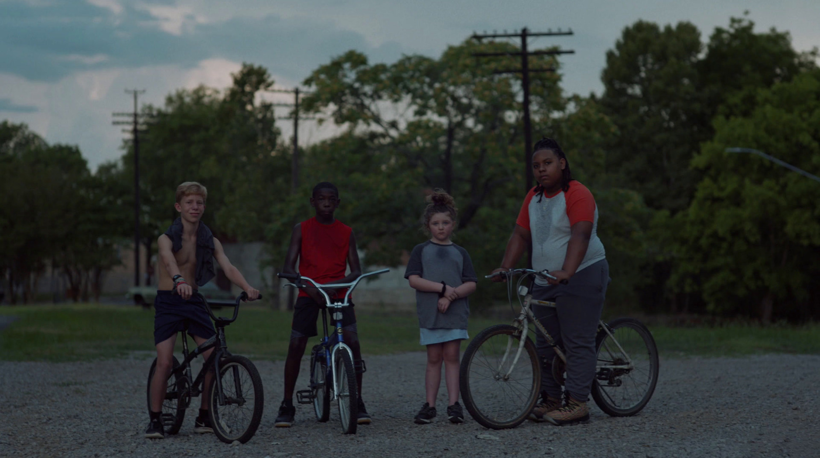 a group of people standing next to each other on bikes