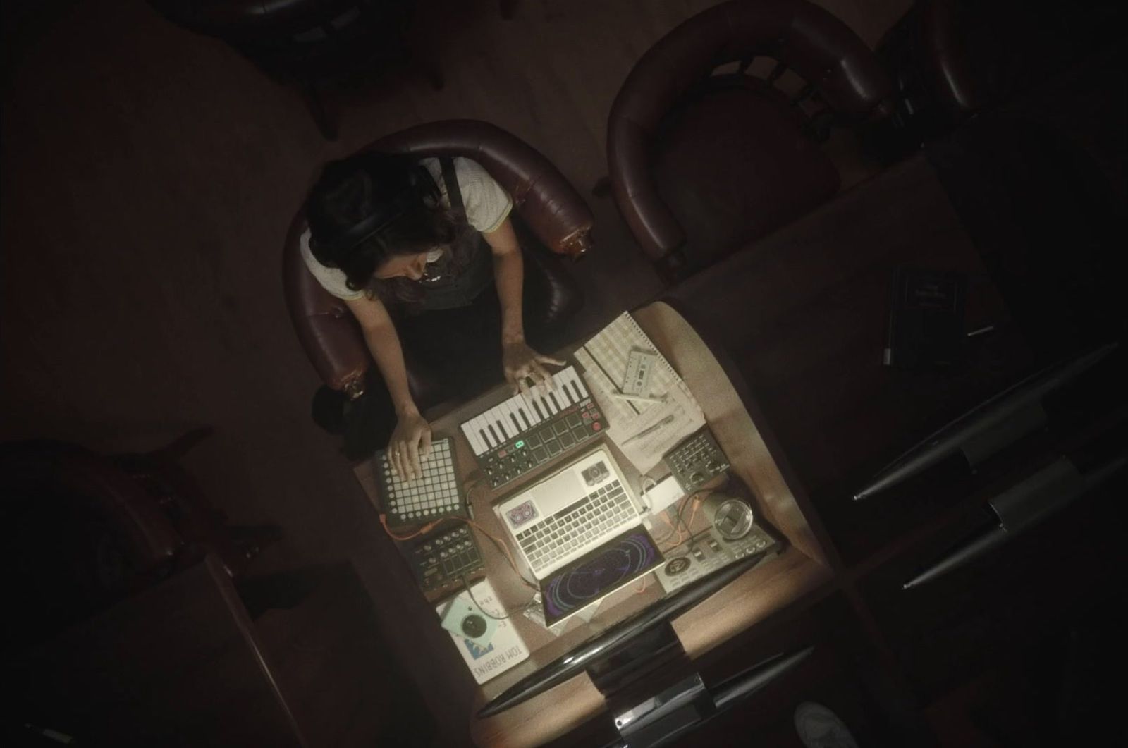 a person sitting at a desk with a keyboard