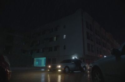 a couple of cars that are sitting in the street