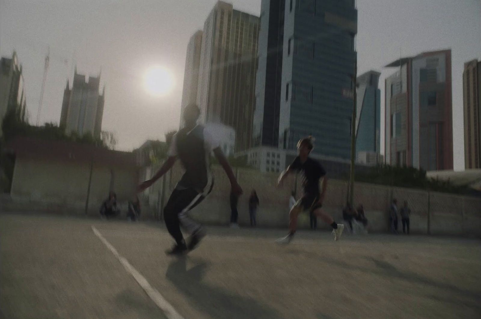 a group of young men playing a game of frisbee