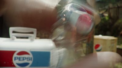 a can of pepsi sitting on a table