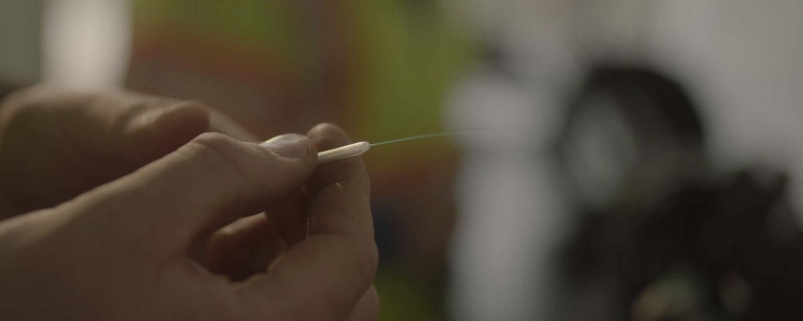 a person holding a toothbrush in their hand