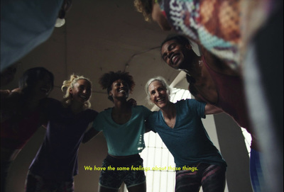 a group of people standing together in a gym