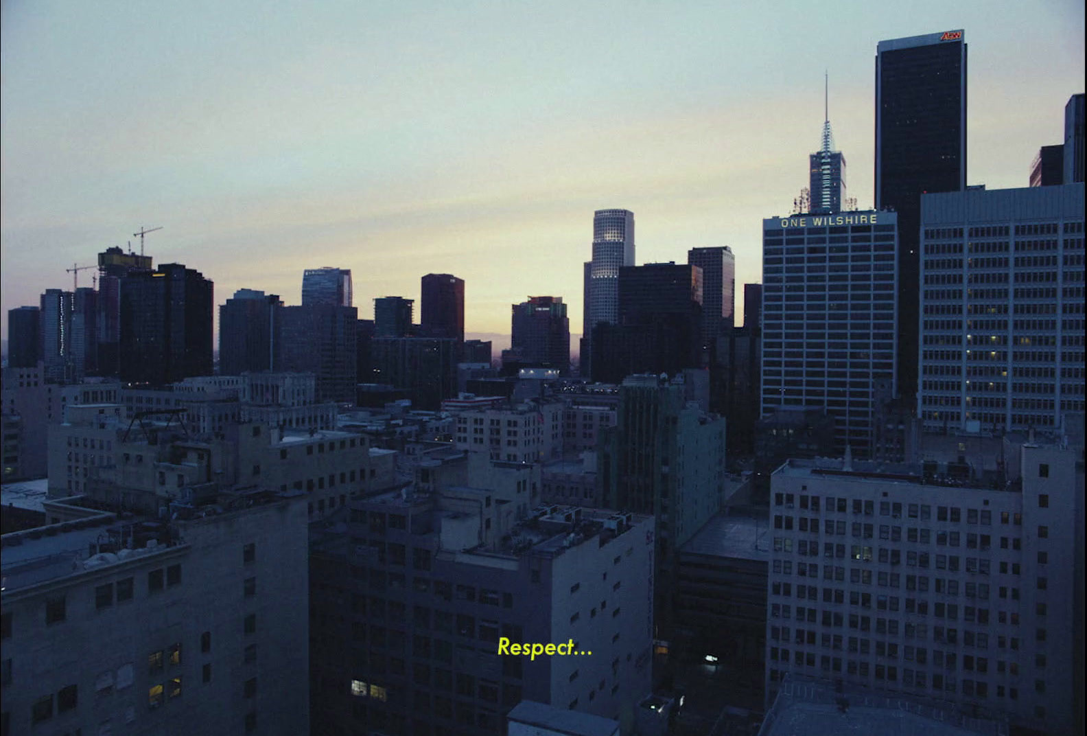 an aerial view of a city at dusk