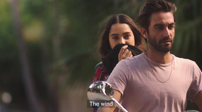 a man and a woman riding a motorcycle