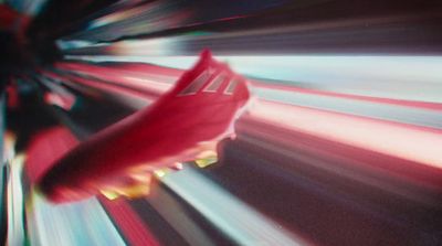 a close up of a soccer shoe on a blurry background