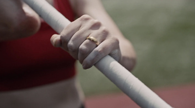 a close up of a person holding a white pole