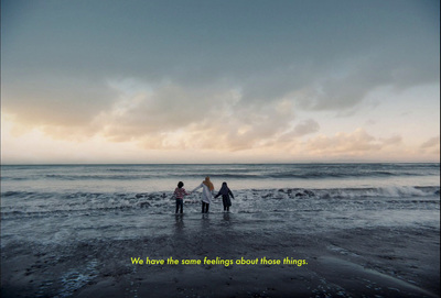 three people standing on the beach with a quote