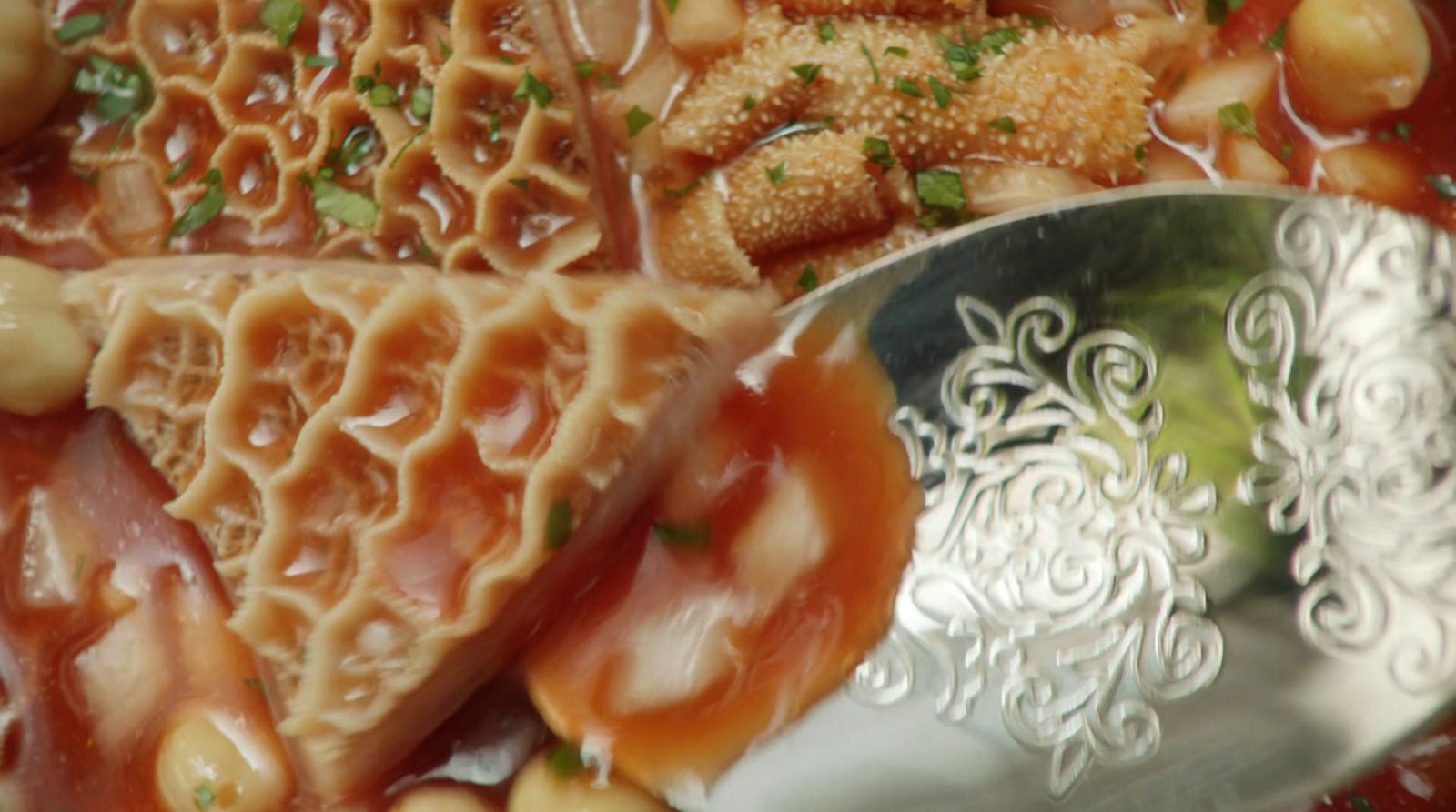 a close up of food on a plate with a spoon