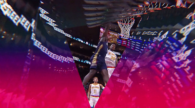 a basketball player dunking a basketball in the air