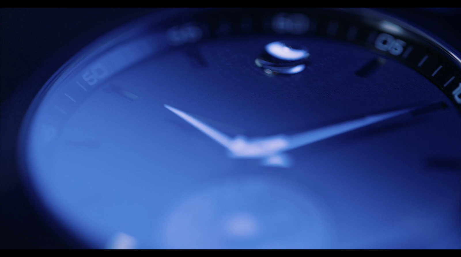 a close up of a clock with a blue background