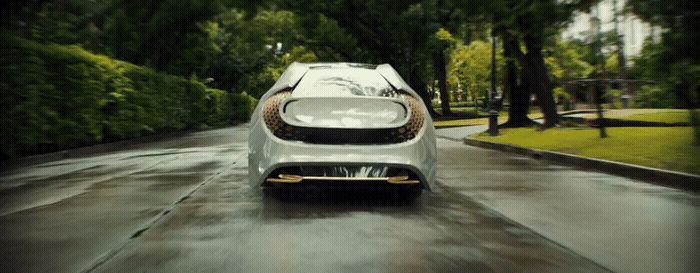 a white car driving down a wet road