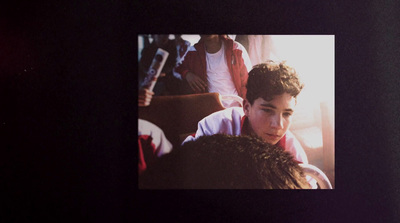 a photo of a young man in a red shirt