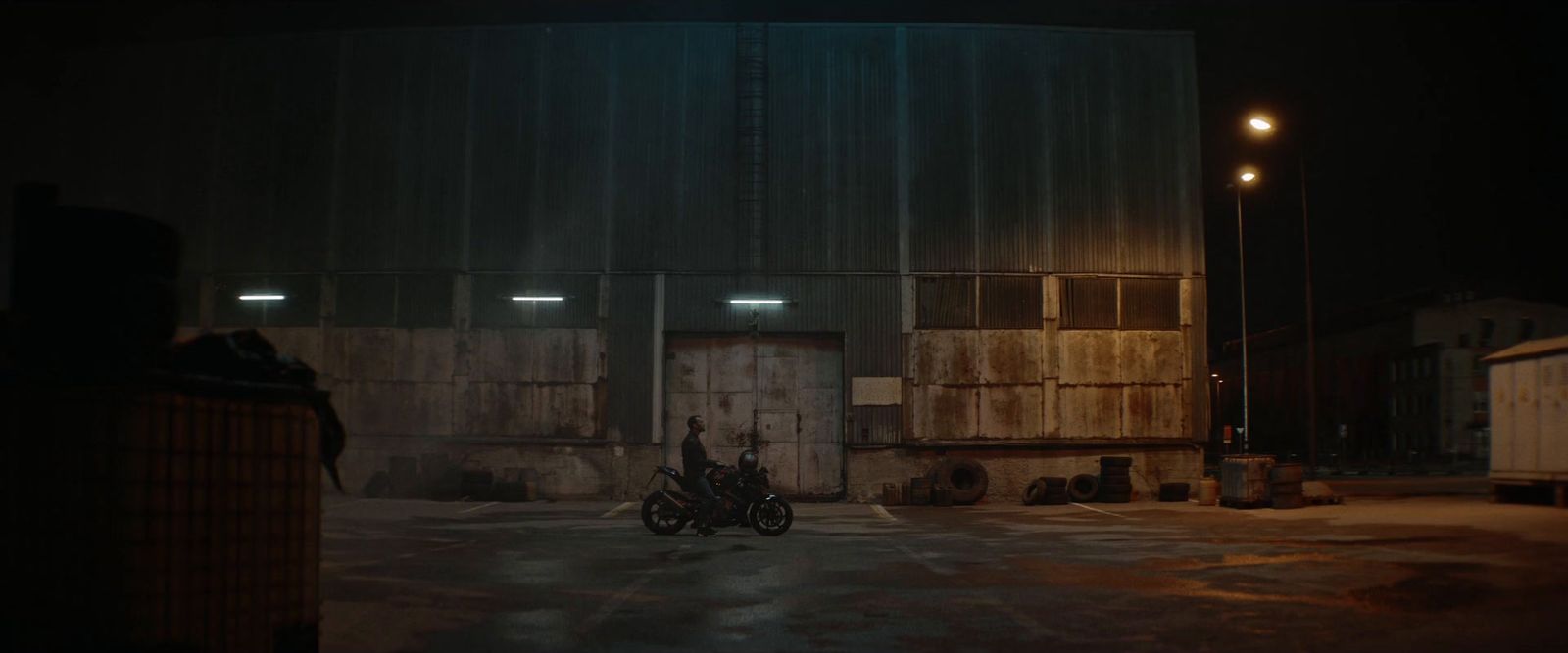 a couple of motorcycles parked in front of a building