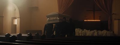 a man standing in front of a church pew