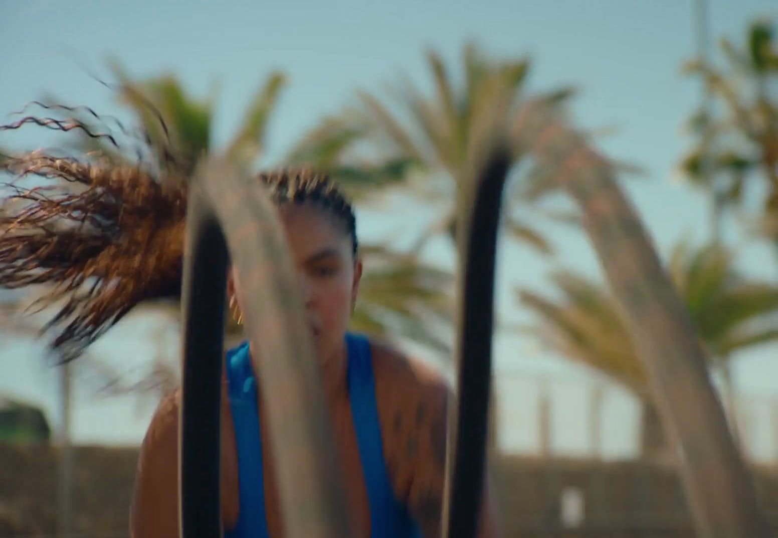 a woman with her hair blowing in the wind