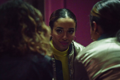 a group of women in a room talking to each other