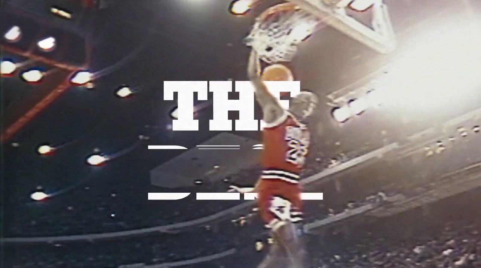 a basketball player dunking a basketball in the air