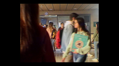 a group of people standing in a hallway