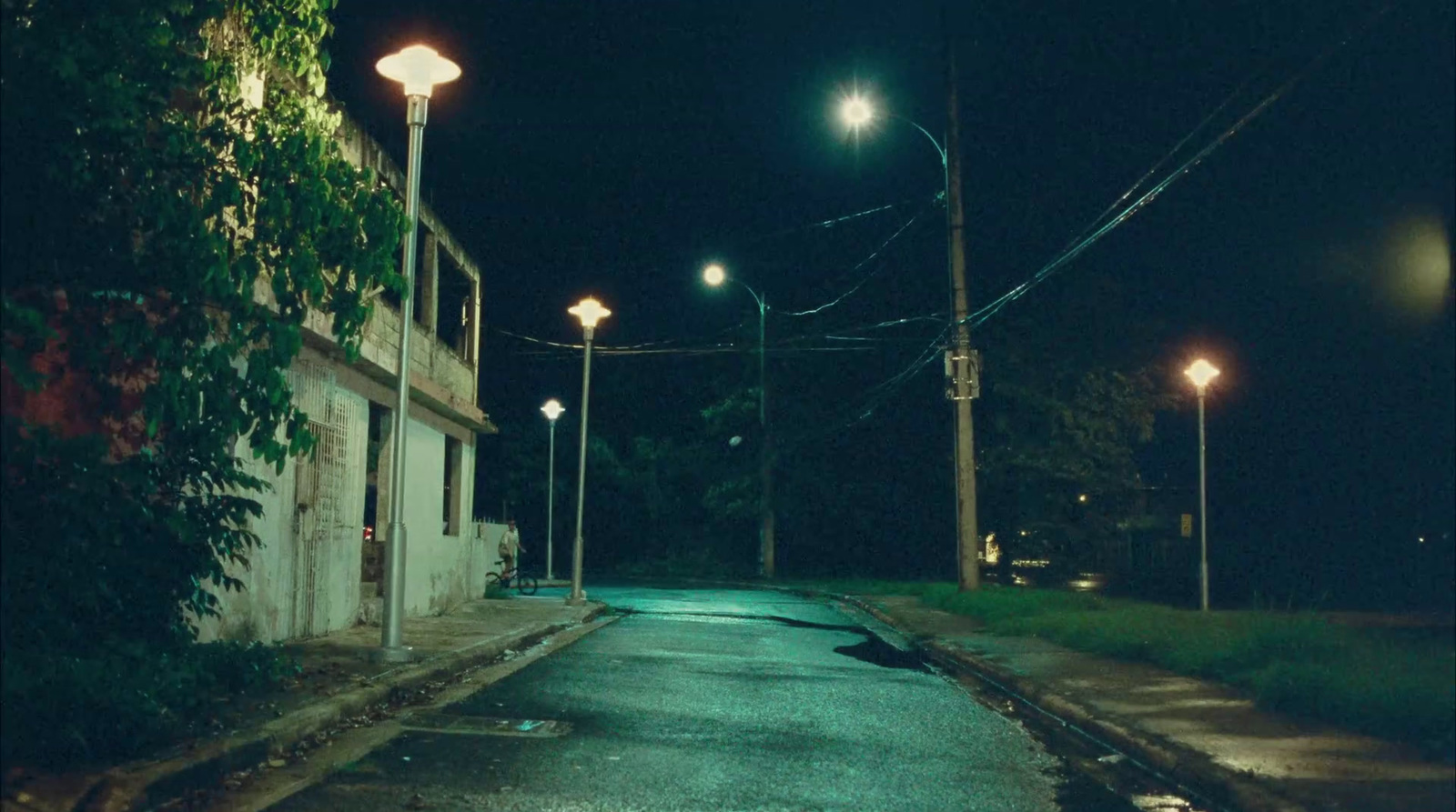 an empty street at night with street lights