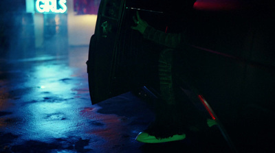 a person sitting on a bus in the dark