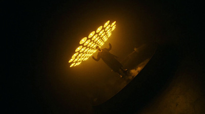 a close up of a street light in the dark