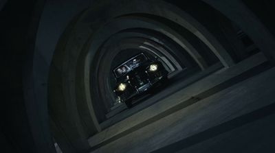 a car driving through a tunnel in the dark