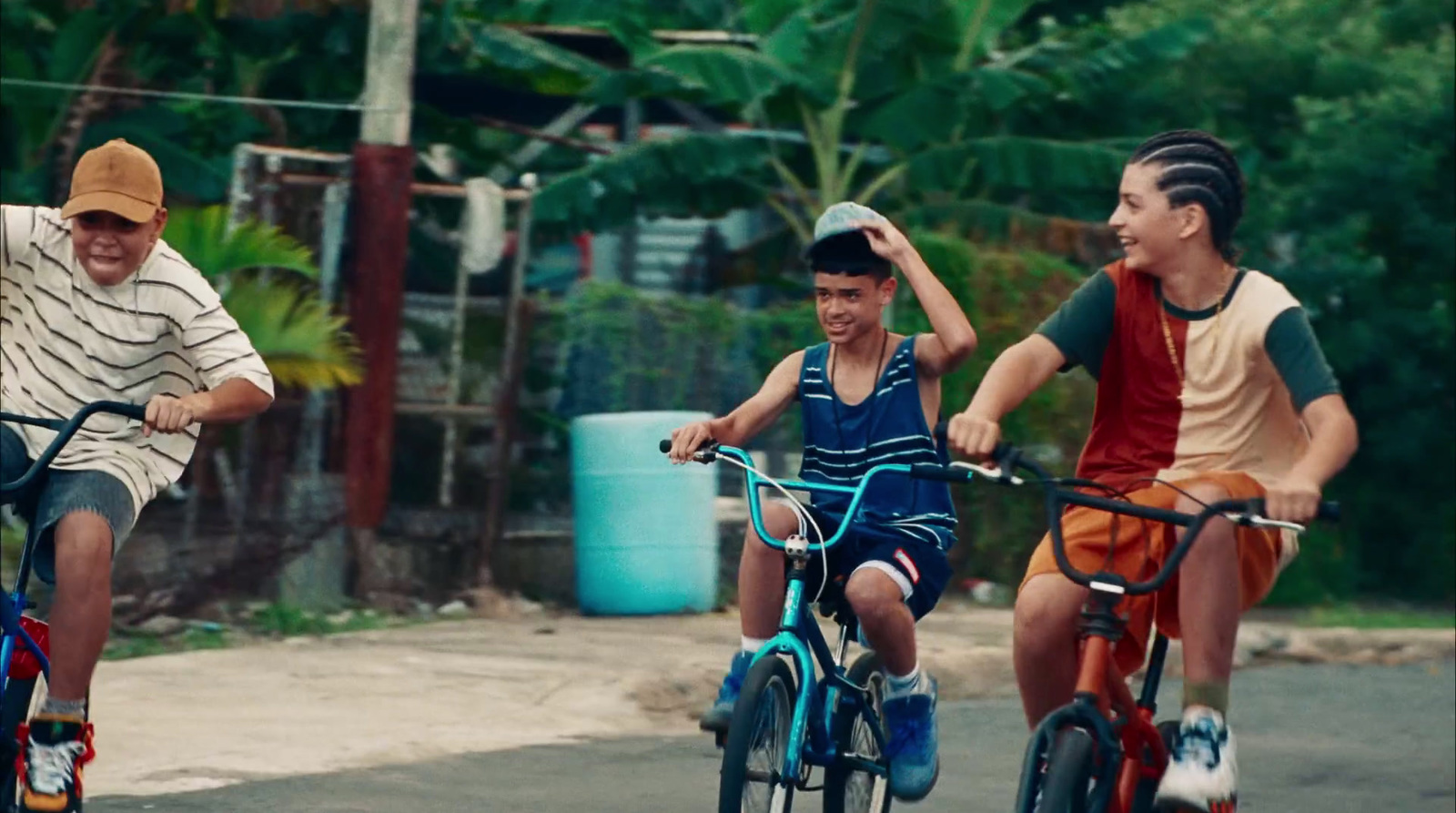 a group of people riding bikes down a street