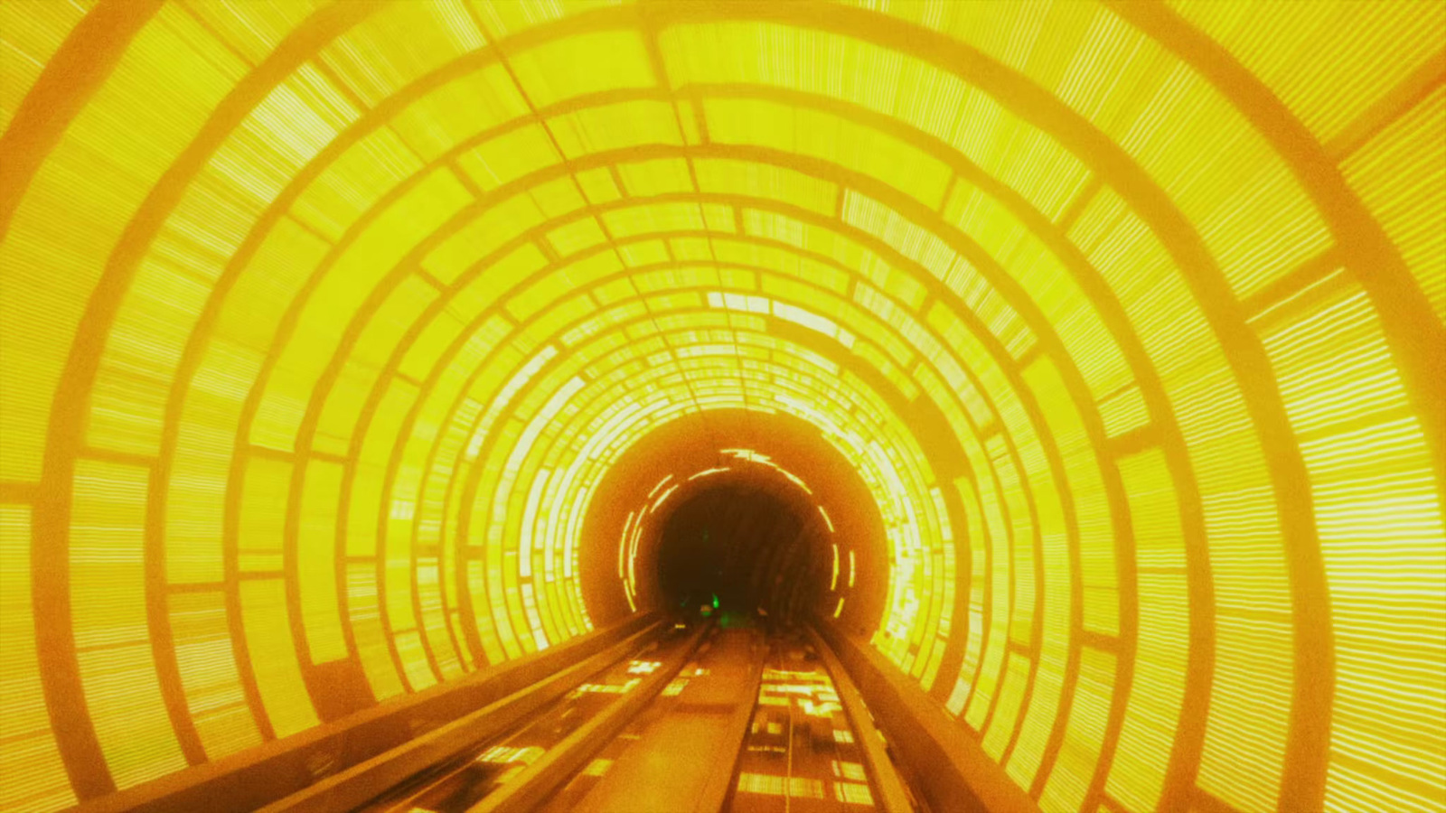 a tunnel with a train going through it