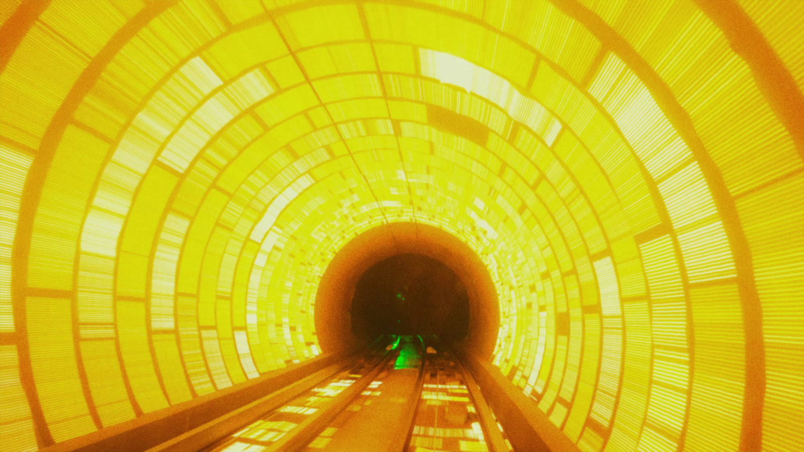 a tunnel with a train going through it