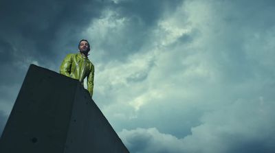 a man standing on top of a cement structure