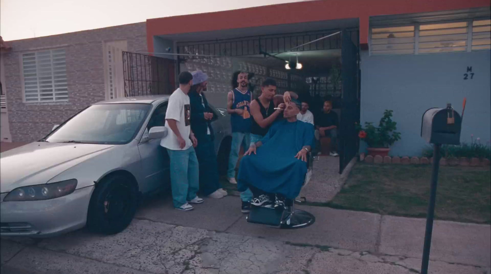 a group of people standing in front of a car