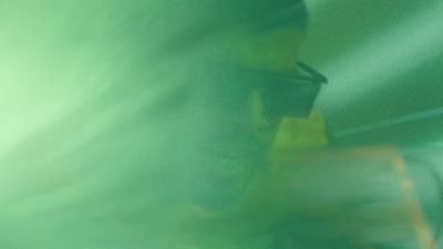 a blurry photo of a man with a cell phone