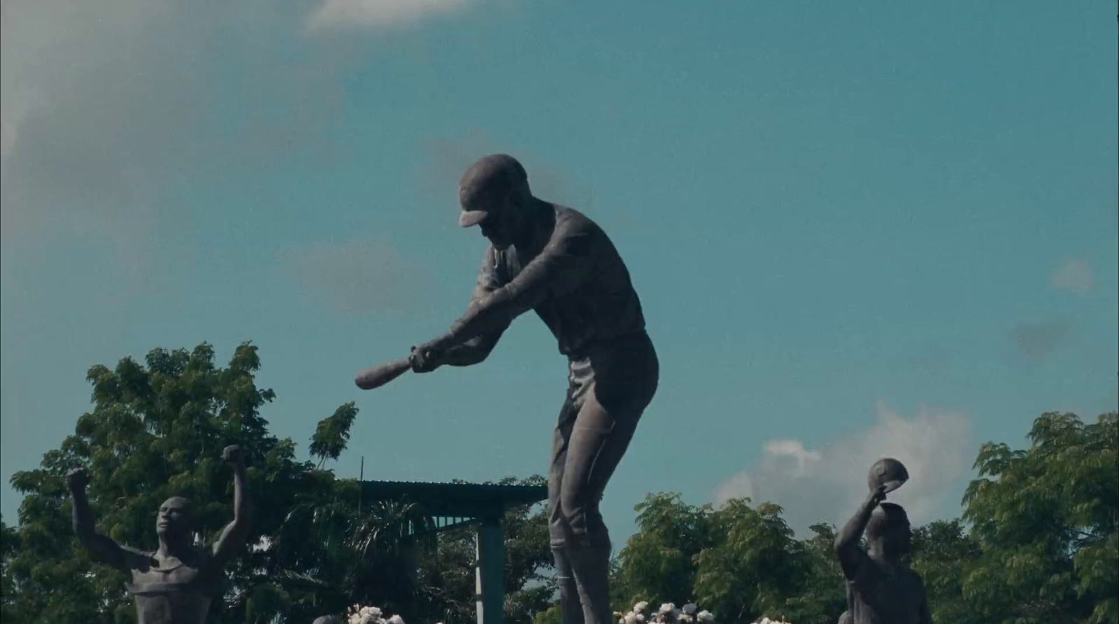 a statue of a baseball player swinging a bat