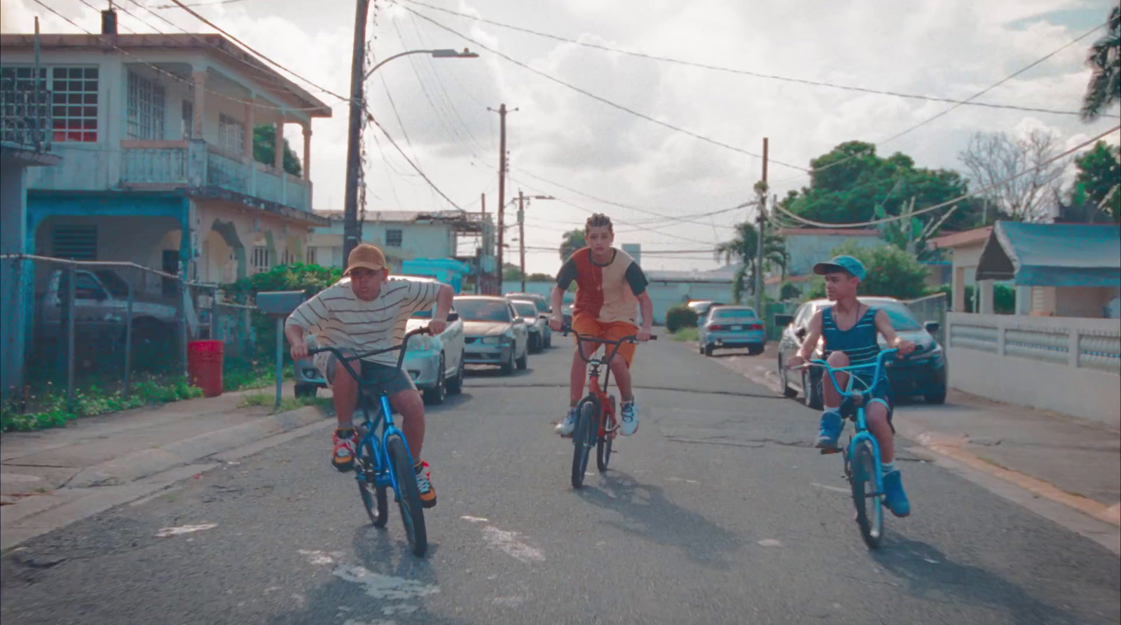 a group of people riding bikes down a street