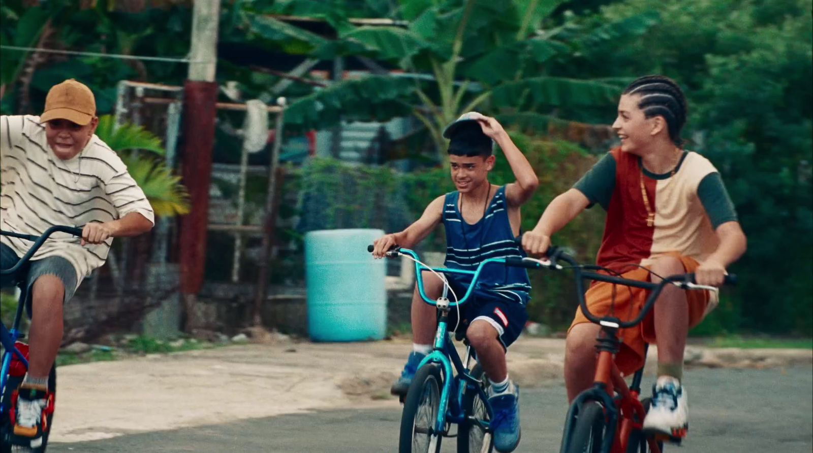 a group of people riding bikes down a street