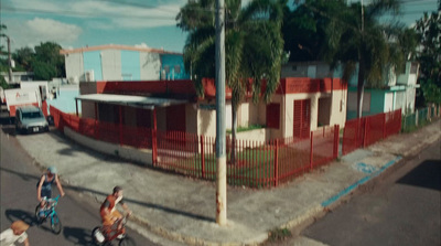 a group of people riding bikes down a street