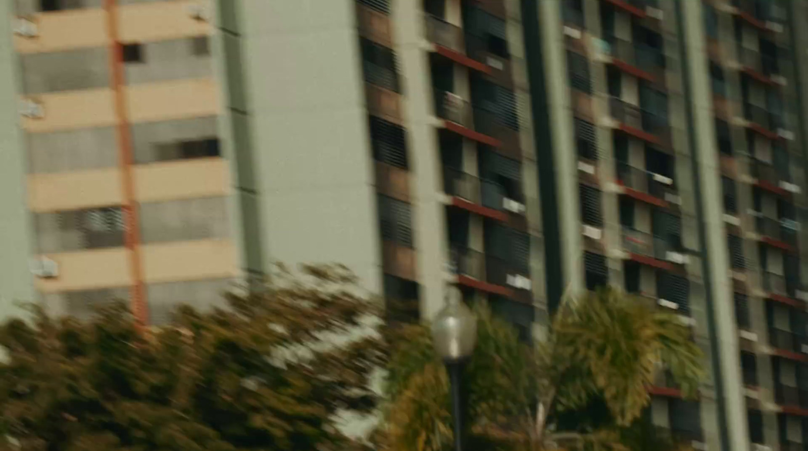 a stop sign in front of a tall building