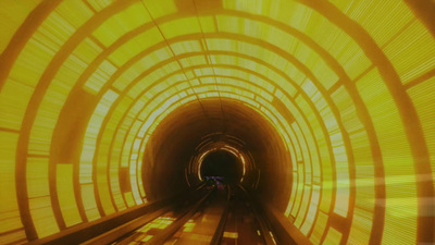 a tunnel with a train going through it